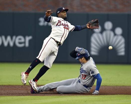 Baseball: Division Series between Dodgers and Braves Los Angeles Dodgers designated hitter Shohei Ohtani (R) steals second base as Atlanta Braves second baseman Ozzie Albies fails to gather the ball during the second inning of Game 4 of the National League Division Series at Truist Park in Atlanta on Oct. 7, 2026.  A14AA0005630401P