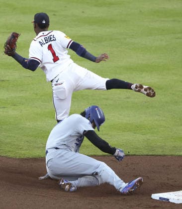 Baseball: Division Series between Dodgers and Braves Los Angeles Dodgers designated hitter Shohei Ohtani steals second base as Atlanta Braves second baseman Ozzie Albies (1) fails to gather the ball during the second inning of Game 4 of the National League Division Series at Truist Park in Atlanta on Oct. 7, 2026.  A14AA0005630404P