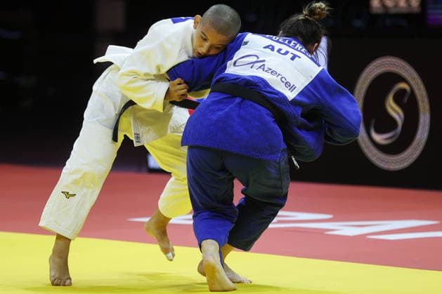 AZERBAIJAN, BAKU - OCTOBER 8, 2026: Ai Tsunoda Roustant (L) of Spain and Michaela Polleres of Austria compete in their -70 kg bout as part of the 2026 World Judo Championships at the National Gymnastics Arena. Mikhail Sinitsyn TASS  98957463
