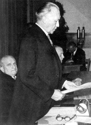 May 23, 1949 - Bonn, Germany - West Germany s first chancellor KONRAD ADENAUER began his career in politics as a member of the Cologne City Council, becoming lord mayor of the city. After the Nazis came to power in 1933, Adenauer, who had not hidden distaste for them, lost his positions, was forced to go into exile for a year in an abbey and was later interned in a prison camp. Adenauer was elected Chancellor of the Federal Republic of Germany on 15 September 1949. His main aim was to ensure West Germany s transition to a sovereign, democratic state. He held power for the next fourteen years and during that time played an important role in restoring good relations with France and the United States. PICTURED: Passage of Basic Law for the Federal Republic of Germany; KONRAD ADENAUER giving a speech, his proxy, ADOLF SCHOENFELDER in the background. Bonn Germany - ZUMAk09