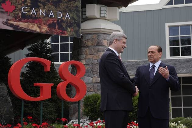 HUNSTVILLE, CANADA. JUNE 25, 2010. Canadian Prime Minister Stephen Harper (L) greets Prime Minister Silvio Berlusconi of Italy before G8 Summit.  Highlight RE0D2AA8