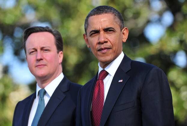 U.S. President Barack Obama (R) and the Prime Minister of the United Kingdom David Cameron stand together during Cameron s official arrival ceremony on the South Lawn of the White House in Washington, D.C. on March 14, 2012.  WAP20120314304