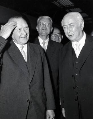 May 24, 1956 - Bonn, Germany - West Germany s first chancellor KONRAD ADENAUER began his career in politics as a member of the Cologne City Council, becoming lord mayor of the city. After the Nazis came to power in 1933, Adenauer, who had not hidden distaste for them, lost his positions, was forced to go into exile for a year in an abbey and was later interned in a prison camp. Adenauer was elected Chancellor of the Federal Republic of Germany on 15 September 1949. His main aim was to ensure West Germany s transition to a sovereign, democratic state. He held power for the next fourteen years and during that time played an important role in restoring good relations with France and the United States. PICTURED: KONRAD ADENAUER and German president THEODOR HEUSS. Vice Chancellor FRANZ BLUCHER in the middle. Bonn Germany  - ZUMAk09