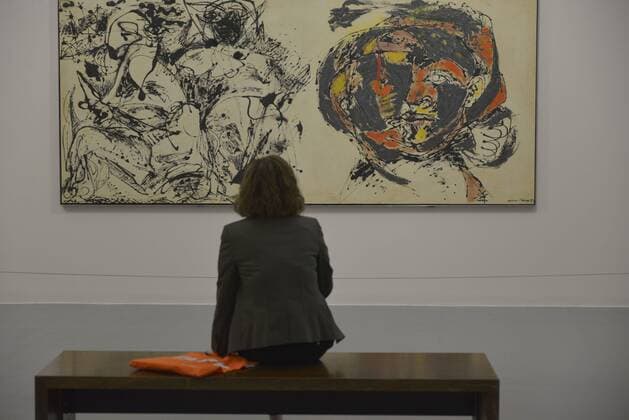 June 29, 2015 - Liverpool, England, UK - A woman poses for pictures beside a work of art entitled Portrait and a Dream by US artist Jackson Pollock during a photocall for the exhibition: Jackson Pollock: Blind Spots at the Tate Liverpool in Liverpool, north west England, on June 29, 2015. The gallery is presenting the exhibition which feature the paintings of Jackson Pollock (1912-1956), made between 1951 and 1953. Liverpool UK  - ZUMAn230
