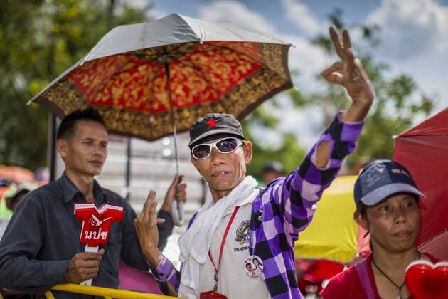 May 10, 2014 - Bangkok, Bangkok, Thailand - A supporter of Yingluck Shinawatra dances at a Red Shirt rally in Bangkok. Thousands of Thai Red Shirts, members of the United Front for Democracy Against Dictatorship (UDD), members of the ruling Pheu Thai party and supporters of the government of ousted Prime Minister Yingluck Shinawatra are rallying on Aksa Road in the Bangkok suburbs. The government was ousted by a court ruling earlier in the week that deposed Yingluck because the judges said she acted unconstitutionally in a personnel matter early in her administration. Thailand now has no functioning government. Red Shirt leaders said at the rally Saturday that any attempt to impose an unelected government on Thailand could spark a civil war. This is the third consecutive popularly elected UDD supported government ousted by the courts in less than 10 years. - ZUMAk94