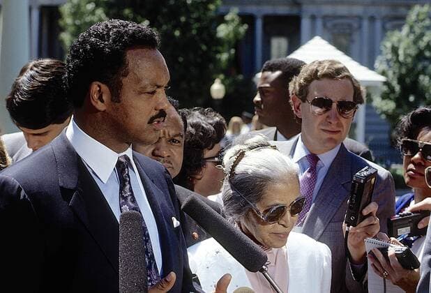 Feb. 12, 2015 - Washington, District of Columbia, United States of America - Washington, DC. 6-30-1989.Jesse Jackson along with Rosa Parks and Walter E. Fauntroy meet with members of the press in the West Wing driveway after attending a celebration in the East Room with President George H.W. Bush marking the 25th anniversary of the signing of the Civil RIghts Act .Credit: Washington United States of America - ZUMAr142