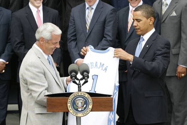 May 11, 2009 - Washington, District of Columbia, USA - UNC Men s Basketball Head Coach ROY WILLIAMS presents President BARACK OBAMA with an honorary UNC Basketball Jersey outside of the White House. President Obama hosted the University of North Carolina Basketball Team at the White House to congratulate them on their NCAA Tournament Victory.  - ZUMA