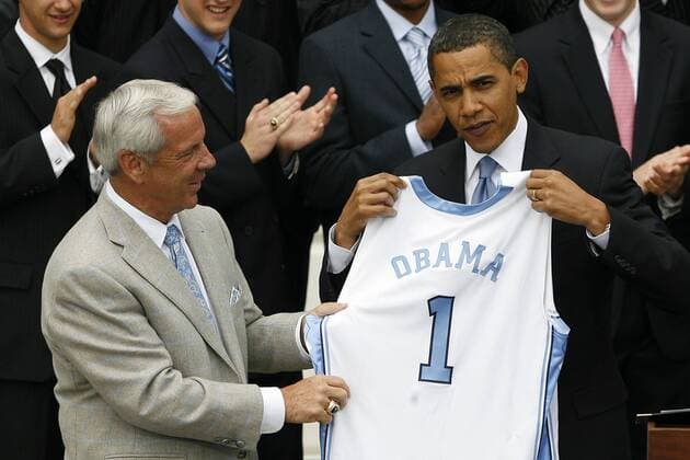 May 11, 2009 - Washington, District of Columbia, USA - UNC Men s Basketball Head Coach ROY WILLIAMS presents President BARACK OBAMA with an honorary UNC Basketball Jersey outside of the White House. President Obama hosted the University of North Carolina Basketball Team at the White House to congratulate them on their NCAA Tournament Victory.  - ZUMA