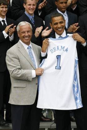 May 11, 2009 - Washington, District of Columbia, USA - UNC Men s Basketball Head Coach ROY WILLIAMS presents President BARACK OBAMA with an honorary UNC Basketball Jersey outside of the White House. President Obama hosted the University of North Carolina Basketball Team at the White House to congratulate them on their NCAA Tournament Victory.  - ZUMA