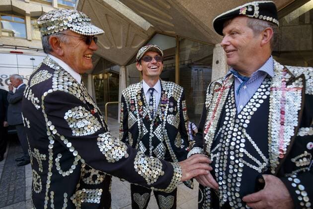 September 25, 2016 - London, London, UK - London, UK. Pearly Kings and Queens Harvest Festival celebrations take place at Guildhall Yard in London as 140-year-old Pearly tradition continues on 25 September 2016. Dressed in dark suits covered in hundreds of bright pearl buttons, the Pearly Kings and Queens of London follow the charity tradition of Henry Croft, an orphan who worked as a street sweeper in the market of Somers Town, London in the 19th century. London UK  - ZUMAl94_