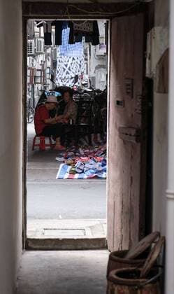 September 7, 2016 - Los Angeles, California, U.S - Street hawker sells sandals at the old residential district near Yu Garden in Shanghai, China. Shanghai is the most populous city in China and the most populous city proper in the world. It is one of the four direct-controlled municipalities of China, with a population of more than 24 million as of 2014. It is a global financial centre, and a transport hub with the world s busiest container port. Located in the Yangtze River Delta in East China, Shanghai sits on the south edge of the mouth of the Yangtze in the middle portion of the Chinese coast. The municipality borders the provinces of Jiangsu and Zhejiang to the north, south and west, and is bounded to the east by the East China Sea. A major administrative, shipping, and trading town, Shanghai grew in importance in the 19th century due to trade and recognition of its favourable port - ZUMAc68_