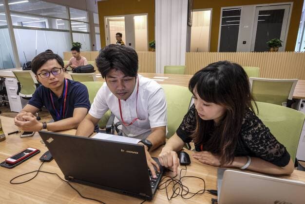 September 12, 2016 - Los Angeles, California, U.S - Employees for the TechWork company at the Zhang Jiang business district in Shanghai, China. Shanghai is the most populous city in China and the most populous city proper in the world. It is one of the four direct-controlled municipalities of China, with a population of more than 24 million as of 2014. It is a global financial centre, and a transport hub with the world s busiest container port. Located in the Yangtze River Delta in East China, Shanghai sits on the south edge of the mouth of the Yangtze in the middle portion of the Chinese coast. The municipality borders the provinces of Jiangsu and Zhejiang to the north, south and west, and is bounded to the east by the East China Sea. A major administrative, shipping, and trading town, Shanghai grew in importance in the 19th century due to trade and recognition of its favourable port lo - ZUMAc68_
