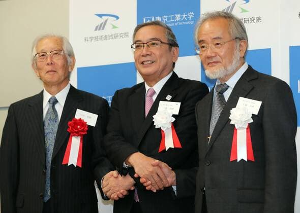October 7, 2016, Yokohama, Japan - Tokyo Institute of Technology president Yoshinao Mishima (C ) shakes hands with professor Yoshinori Ohsumi (R ) and 2000 Nobel Prize laureate Hideki Shirakawa during a reception at the Suzukakedai campus of Tokyo Institute of Technology in Yokohama, suburban Tokyo on Friday, October 7, 2016. Ohsumi received the Nobel Prize in Physiology or Medicine 2016.  (lwxa005238)