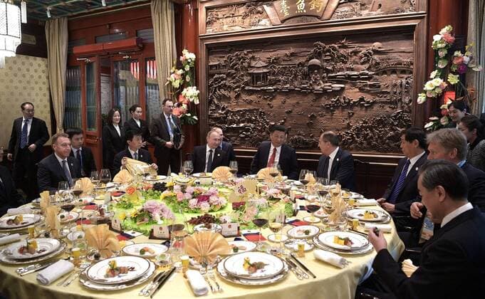 May 15, 2017 - Beijing, China - Chinese President Xi Jinping, center, chats with Russian Foreign Minister Sergey Lavrov, right, as Russian President Vladimir Putin, left, looks on during a breakfast prior to the opening ceremony of the Belt and Road Forum for International Cooperation May 14, 2017 in Beijing, China. Thirty heads of state gathered in Beijing to reaffirm their commitment to build an open economy and ensure free and inclusive trade. Beijing China - ZUMAp138 20170515_zaa_p138_001 Copyright: xAlexeixNikolskyx