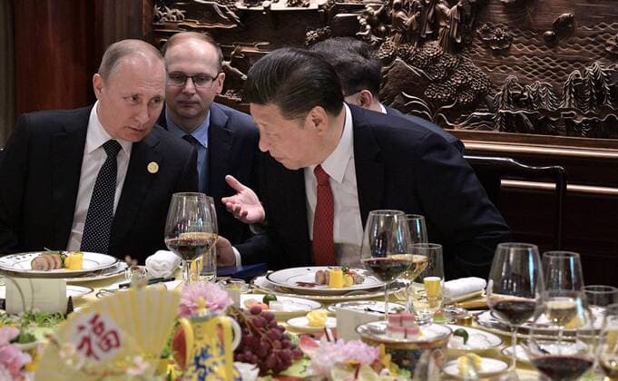 May 14, 2017 - Beijing, China - Chinese President Xi Jinping, right, and Russian President Vladimir Putin chat during a breakfast prior to the opening ceremony of the Belt and Road Forum for International Cooperation May 14, 2017 in Beijing, China. Thirty heads of state gathered in Beijing to reaffirm their commitment to build an open economy and ensure free and inclusive trade. Beijing China - ZUMAp138 20170514_zaa_p138_003 Copyright: xAlexeixNikolskyx