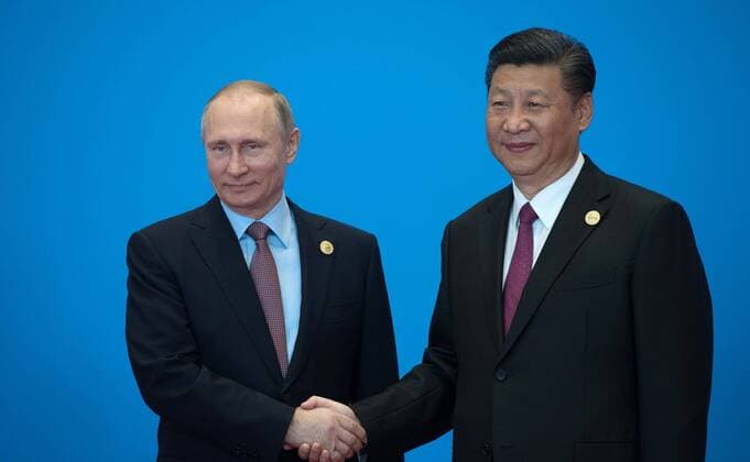 May 15, 2017 - Beijing, China - Chinese President Xi Jinping, right, and Russian President Vladimir Putin shake hands at the start of the Belt and Road Forum for International Cooperation May 15, 2017 in Beijing, China. Thirty heads of state gathered in Beijing to reaffirm their commitment to build an open economy and ensure free and inclusive trade. Beijing China - ZUMAp138 20170515_zaa_p138_005 Copyright: xAlexeixNikolskyx