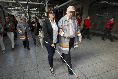 - BRUSSELS, BELGIUM: MR Minister of Mobility Jacqueline Galant pictured during the awareness activity Encounter in the dark , at Brussels Zuid-Midi railway station, Tuesday 29 September 2015. Ministers Galant and Sleurs are wearing opaque glasses to simulate a train journey of a blind. KRISTOFxVANxACCOM  x85756286x