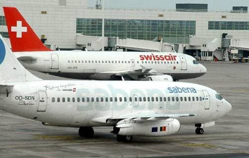 BRU22--BRUSSELS, BELGIUM: FILE PICTURE dated 11 November 2000 showing a view of the last Sabena Boeing 737-200 which is waiting next to a Swissair plane to make his last flight to Goteborg, Sweden, this Thursday, 30 November, 2000, at Brussels National Airport. Sabena and Swiss Air reached this Sunday 21 January 2001, an agreement to assure a profitable futur for Sabena. BERTRANDxDELETTRE  x581891x