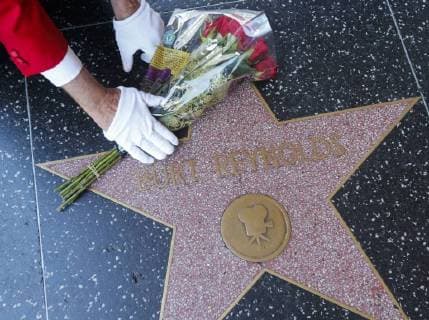 September 6, 2018 - Los Angeles, California, U.S - Gregg Donovan places flowers on Burt Reynolds s star on the Hollywood Walk of Fame, in Los Angeles, Thursday Sept. 6, 2018. Reynolds died at Jupiter Medical Center in Florida at age 82. Los Angeles U.S. - ZUMAc68_ 20180906_zaf_c68_002 Copyright: xRingoxChiux