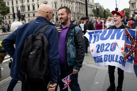 September 5, 2018 - London, London, UK - London, UK. NOTE: FILE PHOTO. James Goddard (centre) and Max Hammet-Millay (right) videos a passerby during a Brexit demonstration in September. The pair have been accused of being part of the group calling Conservative MP Anna Soubry a Nazi on Monday this week. ORIGINAL CAPTION: Anti-Brexit demonstrators and some far-right sympathisers campaign outside the Houses of Parliament, calling for Britain s immediate exit from the EU, and the re-instating of former Foreign Secretary Boris Johnson. London UK  - ZUMAl94_ 20180905_zaf_l94_095 Copyright: xTomxNicholsonx