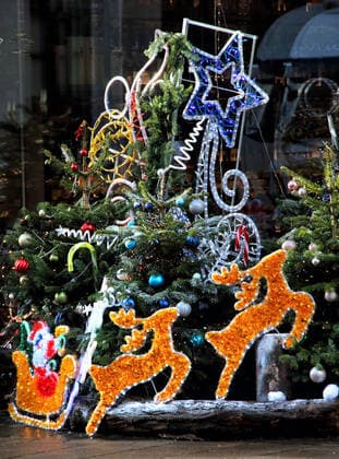 December 19, 2020, London, United Kingdom: Large display of Christmas trees and various Christmas decorations outside Hedonism wines in central London..Despite London being placed under extremely high Tier 4 restrictions to prevent the spread of Covid-19, with indoor venues, non essential retail and clubs all closed and inability to trade, there are many colourful Christmas displays around the city. London United Kingdom - ZUMAs197 20201219_zaa_s197_233 Copyright: xKeithxMayhewx