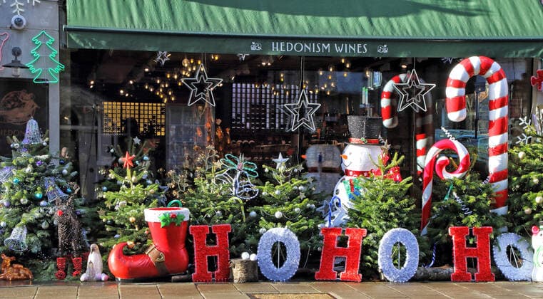 December 19, 2020, London, United Kingdom: Large display of Christmas trees and various Christmas decorations outside Hedonism wines in central London..Despite London being placed under extremely high Tier 4 restrictions to prevent the spread of Covid-19, with indoor venues, non essential retail and clubs all closed and inability to trade, there are many colourful Christmas displays around the city. London United Kingdom - ZUMAs197 20201219_zaa_s197_235 Copyright: xKeithxMayhewx
