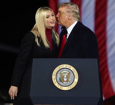 President Donald Trump kisses his daughter Ivanka Trump after introducing her to the the crowd at the Dalton Regional Airport at a Republican rally for Georgia Senators Kelly Loeffler and David Perdue in Dalton, Georgia on Monday, January 4, 2021.  ATL20210104113 TAMIxCHAPPELL