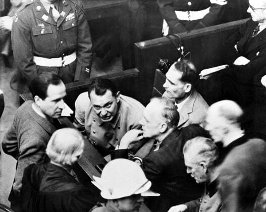 International Military Tribunal (IMT) November 20, 1945 - October 1, 1946 The defendants Hermann Göring, Karl Dönitz, Wilhelm Keitel and Rudolf Hess (above Karl Dönitz) are talking to defense lawyers at the Nuremberg International War Crimes Trial. Nuremberg, Germany 1946 ! ACHTUNG: AUFNAHMEDATUM GESCHÄTZT!