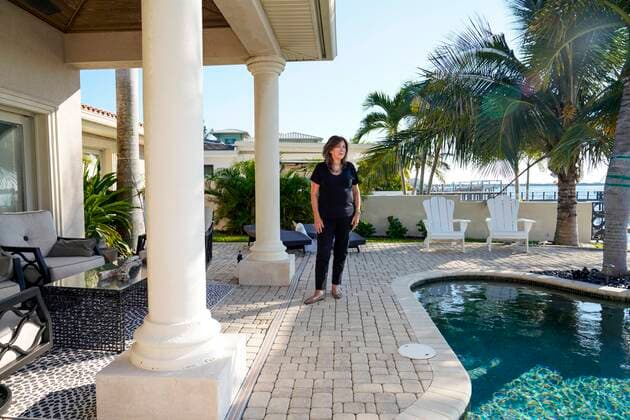September 24, 2021, St. Petersburg, Florida, USA: Melinda Pletcher, a St. Pete Beach city commissioner, poses for a portrait at her waterfront home in the Vina Del Mar neighborhood on St. Pete Beach. PletcherÃ¢â‚¬â ¢s annual rate on her home will be going from $600 to $8,000 over several years due to FEMA overhauling the National Flood Insurance Program, the source of the vast majority of flood insurance policies in Florida, Friday, September 24, 2021 in St. Petersburg. St. Petersburg USA - ZUMAs70_ 20210924_zan_s70_005 Copyright: xMarthaxAsencio-Rhinex