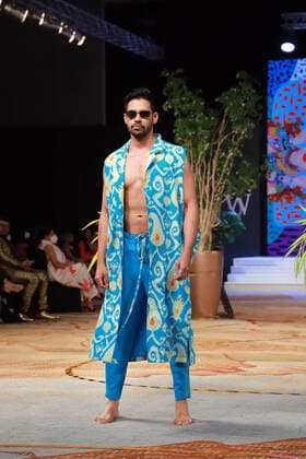 (211113) -- COLOMBO, Nov. 13, 2021 -- A model presents a creation during the Colombo Fashion Week (CFW) Swim Week in Colombo, Sri Lanka, on Nov. 12, 2021. The CFW Swim Week Colombo, scheduled for Nov. 12 and 13 in the national capital Colombo, will showcase works created by 11 local designers. (Photo by Xinhua) SRI LANKA-COLOMBO-FASHION WEEK AjithxPerera