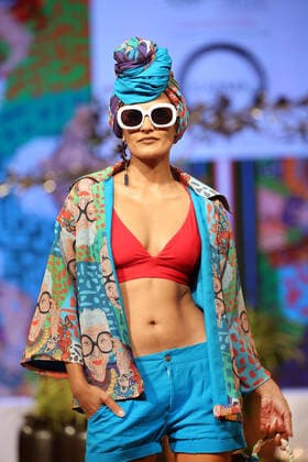 (211113) -- COLOMBO, Nov. 13, 2021 -- A model presents a creation during the Colombo Fashion Week (CFW) Swim Week in Colombo, Sri Lanka, on Nov. 12, 2021. The CFW Swim Week Colombo, scheduled for Nov. 12 and 13 in the national capital Colombo, will showcase works created by 11 local designers. (Photo by Xinhua) SRI LANKA-COLOMBO-FASHION WEEK AjithxPerera
