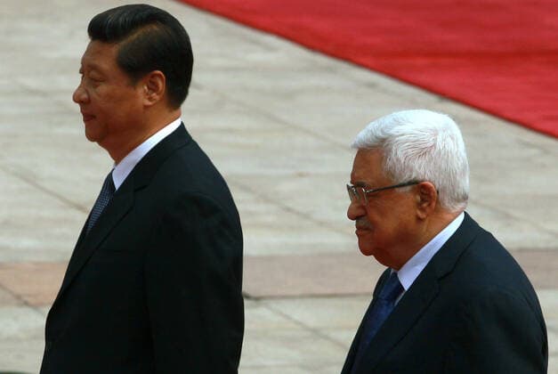 May 6, 2013, BEIJING, CHINA: Chinese President Xi Jinping (L) and visiting Palestinian President Mahmoud Abbas attend a welcoming ceremony at the Great Hall of the People in Beijing on May 6, 2013. China is hosting the leaders of Palestine and Israel this week in a sign of its desire for a larger role in the Middle East. China said it is willing to set up a meeting between the two countries, which have been deadlocked in talks for four years. BEIJING CHINA - ZUMAs139 20130506_zap_s139_029 Copyright: xStephenxShaverx
