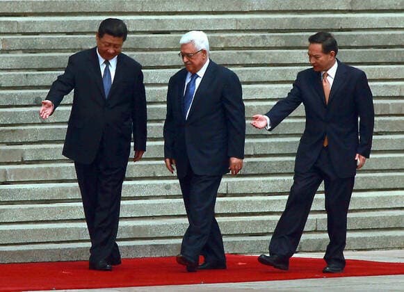 May 6, 2013, BEIJING, CHINA: Chinese President Xi Jinping (L) walks with visiting Palestinian President Mahmoud Abbas during a welcoming ceremony at the Great Hall of the People in Beijing on May 6, 2013. China is hosting the leaders of Palestine and Israel this week in a sign of its desire for a larger role in the Middle East. China said it is willing to set up a meeting between the two countries, which have been deadlocked in talks for four years. BEIJING CHINA - ZUMAs139 20130506_zap_s139_006 Copyright: xStephenxShaverx