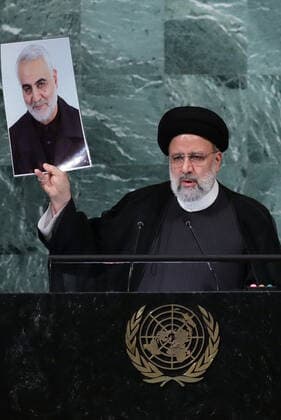 September 21, 2022, New York, New York, United States: Iranian president EBRAHIM RAISI holds up a photo of Qasem Soleimani as he delivers his address during the 77th General Debate inside the General Assembly Hall at United Nations Headquarters in New York, New York, USA, 21 September 2022. New York United States - ZUMAi98_ 20220921_zih_i98_085 Copyright: xIranianxPresidencyx
