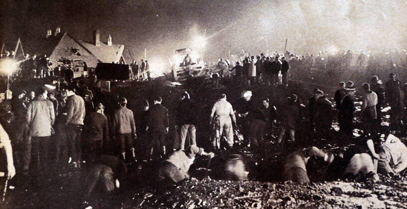 RECORD DATE NOT STATED The Aberfan disaster was the catastrophic collapse of a colliery spoil tip on 21 October 1966. The tip had been created on a mountain slope above the Welsh village of Aberfan, near Merthyr Tydfil, and overlaid a natural spring. A period of heavy rain led to a build-up of water within the tip which caused it to suddenly slide downhill as a slurry, killing 116 children and 28 adults as it engulfed Pantglas Junior School and a row of houses. The tip was the responsibility of the National Coal Board (NCB), and the subsequent inquiry placed the blame for the disaster on the organisation and nine named employees WorldxHistoryxArchive 917_05_wha_166_0176