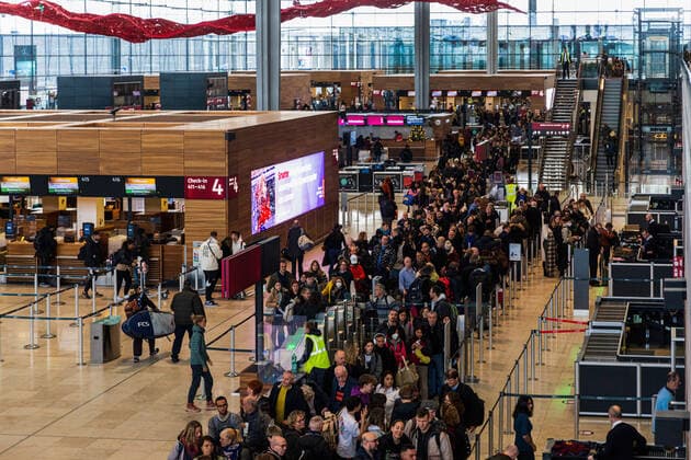 BERLIN, GERMANY - DECEMBER 12, 2022: Long lines building up at the security check at Berlin Brandenburg International Airport. BER Airport still struggles with waiting times of more then half an hour. BER Airport still can t get the waiting time at the security check under control. Berlin Germany