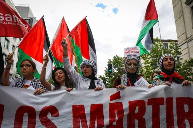 May 14, 2023, Madrid, Spain: Protesters, hold Palestinian flags and a banner during the demonstration. Palestinian residents in the city of Madrid have demonstrated this Sunday in the city of Madrid to commemorate the 75th anniversary of the Nakba..They marched peacefully from the Atocha roundabout to the Plaza de la Provincia where the manifesto was read. Madrid Spain - ZUMAs197 20230514_zaa_s197_363 Copyright: xDavidxCanalesx