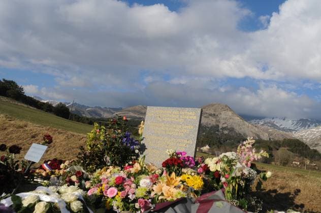 Germanwings A320 Crash Memorial Stele - Le Vernet Flowers lay at a memorial stele made of stone that reads In commemoration of the victims of the plane accident on 24 March 2015 in English, German, Spanish and French, on Easter Sunday in Le Vernet, France, April 5, 2015. Germanwings flight 4U 9525 crashed near near the village of La Vernet in the French Alps, southern France on 24 March 2015, carrying around 150 passengers and crew on board. Photo by Geoffroy Cournut ABACAPRESS.COM Le Vernet France  Copyright: xCournutxGeoffroy ABACAx 494945_004 CournutxGeoffroy ABACAx 494945_004