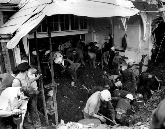 Rescue operations continue AVALANCHE AT ABERFAN - At least 71 people, mostly children have been killed at Aberfan, near Merthyr Tydfil, South Wales, after a rain-soaked coal tip avalanched on an infants school, a farm and a row of houses. Eighty-five children are safe and 36 are in hospital. Photo shows: The search goes on inside the tomb of the school at Aberfan. Date: 22.10.1966., Credit:Photoshot Avalon United Kingdom  Copyright: xPhotoshotx xAvalonx 0502981661
