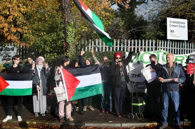 November 13, 2023, London, United Kingdom: Supporters gather outside Snaresbrook Crown Court to listen to speeches and wave flags in solidarity with the defendants. Palestinian Actionists known as ˜The Elbit Eight™ are facing conspiracy charges to commit criminal damage, burglary and some of them, blackmail, against Israeli arms company Elbit systems. The charges go back to 2020. Six weeks have been set aside at court. Palestine Action believe that Elbit™s businesses in the UK manufacture drones that are being used in Gaza and elsewhere against the Palestinian people. Their direct actions against Elbit Systems in the UK have already seen two of their 10 sites closed down. London United Kingdom - ZUMAs197 20231113_aaa_s197_446 Copyright: xMartinxPopex