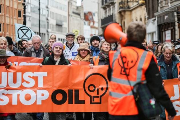 November 18, 2023, London, United Kingdom: Supporters of Just Stop Oil march across London behind large banners saying Just Stop Oil . Just Stop Oil march across London to highlight the need to change the way we depend on oil and gas for energy. They argue that time is running out for the planet and immediate change away from fossil fuels is necessary. They state the government is imprisoning peaceful protestors and protecting the real criminals, rewarding them by licensing more than 100 new oil and gas projects. London United Kingdom - ZUMAs197 20231118_aaa_s197_111 Copyright: xMartinxPopex