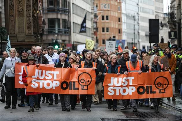 November 18, 2023, London, United Kingdom: Supporters of Just Stop Oil march across London behind large banners saying Just Stop Oil . Just Stop Oil march across London to highlight the need to change the way we depend on oil and gas for energy. They argue that time is running out for the planet and immediate change away from fossil fuels is necessary. They state the government is imprisoning peaceful protestors and protecting the real criminals, rewarding them by licensing more than 100 new oil and gas projects. London United Kingdom - ZUMAs197 20231118_aaa_s197_113 Copyright: xMartinxPopex