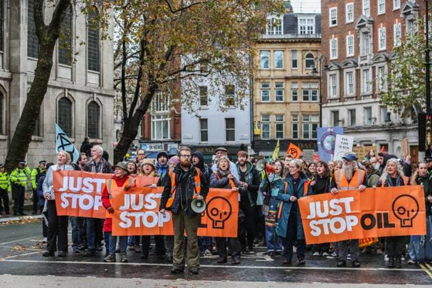 November 18, 2023, London, United Kingdom: Supporters of Just Stop Oil march across London behind large banners saying Just Stop Oil . Just Stop Oil march across London to highlight the need to change the way we depend on oil and gas for energy. They argue that time is running out for the planet and immediate change away from fossil fuels is necessary. They state the government is imprisoning peaceful protestors and protecting the real criminals, rewarding them by licensing more than 100 new oil and gas projects. London United Kingdom - ZUMAs197 20231118_aaa_s197_119 Copyright: xMartinxPopex