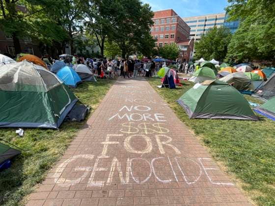 May 3, 2024, Washington, District Of Columbia, USA: The words no more $$$ for genocide are chalked on the sidewalk at The George Washington University encampment. Tents are neatly tethered around the quad. Washington USA - ZUMAd155 20240503_znp_d155_004 Copyright: xSuexDorfmanx