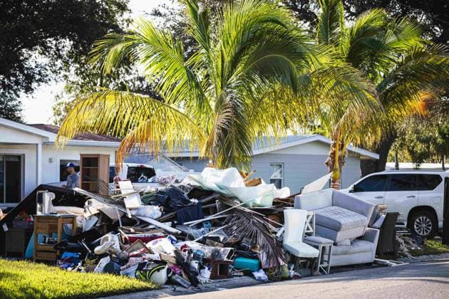 September 29, 2024, St. Petersburg, Florida, USA: Residents of the Riviera Bay neighborhood empty the water damaged contents of the homes that were destroyed due to the record high storm surge caused by Hurricane Helene. St. Petersburg USA - ZUMAd256 20240929_znp_d256_035 Copyright: xDavexDeckerx