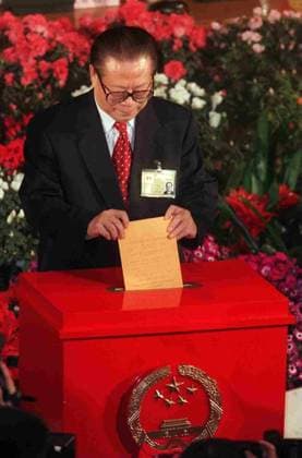 PRESIDENT OF CHINA JIANG ZEMIN PLACES HIS VOTE INTO THE BALLOT BOX IN A NATIONAL PEOPLE S CONGRESS. 15 March 1999