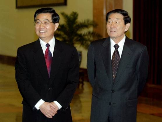 China Jiang Zhu Rongji Hu Jintao Chinese Vice-President Hu Jintao (L) and Premier Zhu Rongji (R) attend a farewell ceremony in Beijing for President Jiang Zemin before his departure to the United States. 22 October 2002