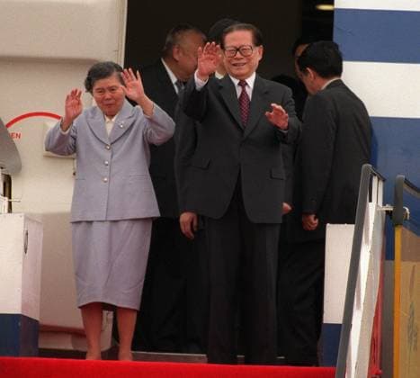 Chinese President Jiang Zemin and his wife Chinese First Lady Wang Yeping wave to the welcoming party when they arrive at Chek Lap Kok International Airport to participate in the celebrations for the 5th anniversary of the handover of Hong Kong. 30 June 2002