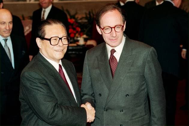 Chinese President Mr Jiang Zemin (left) shaking hands with British Foreign Secretary Mr Malcolm Rifkind after their meeting in Beijing about the handover of Hong Kong to China on July 1, 1997.