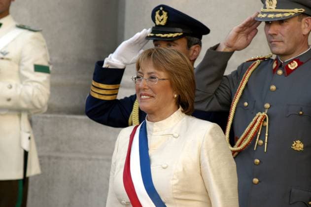 President Michelle Bachelet, center, receives a salute from the presidential palace guard on her way into the Moneda as the first woman to take office as President of Chile, Saturday, March 11, 2006. (Helen Hughes KRT) SANTIAGO CHL EDITORIAL USE ONLY Copyright: xx 1028000 HelenxHughesx krtphotoslive206802